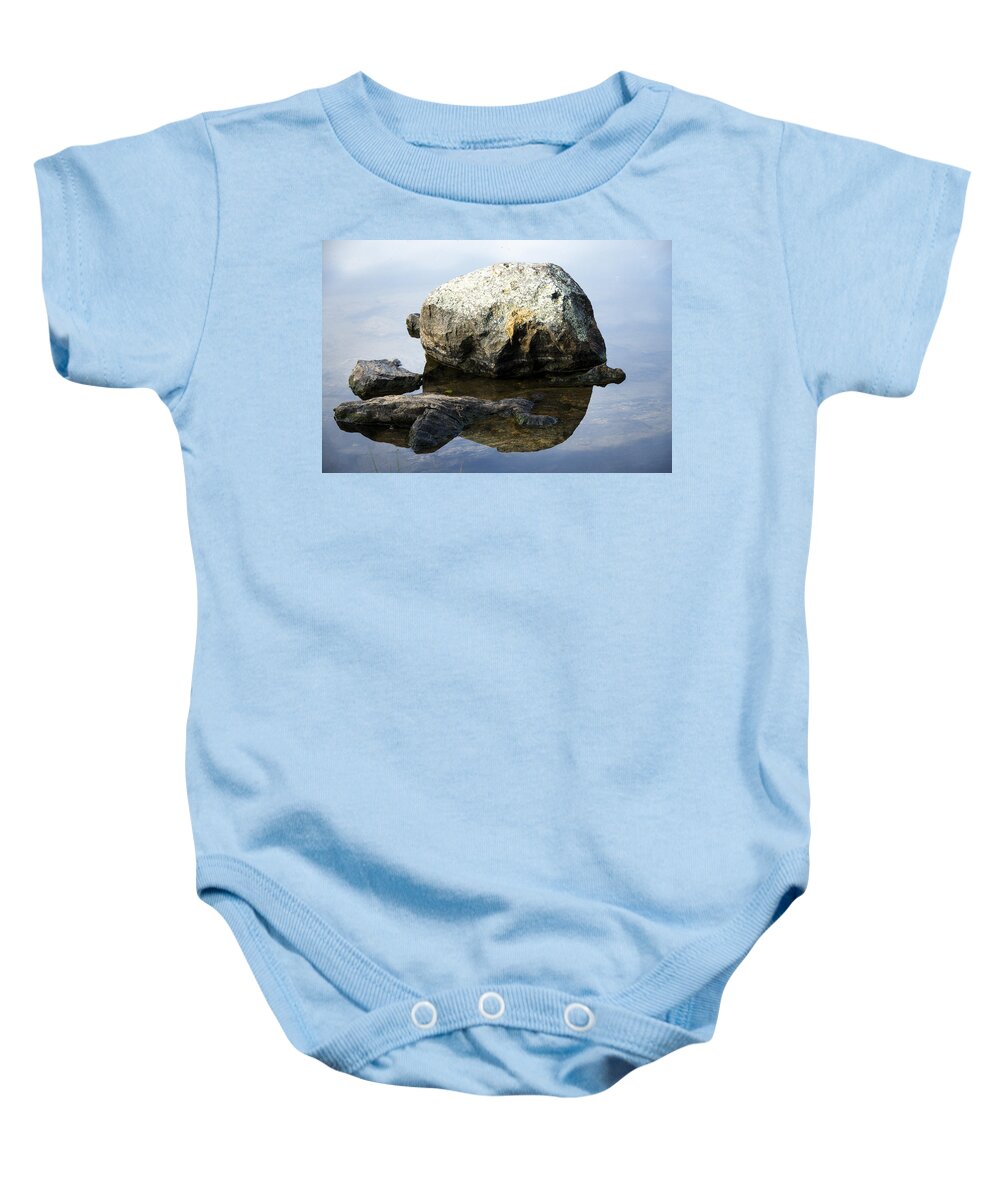 Rock Baby Onesie featuring the photograph A Rock In Still Water by Richard Henne