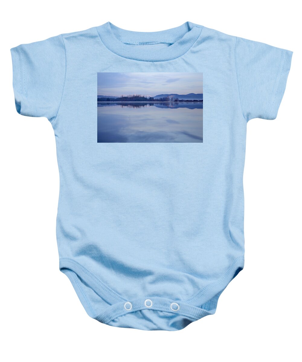 Lake Baby Onesie featuring the photograph Cerknica lake at dawn with snow covered alps in background by Ian Middleton