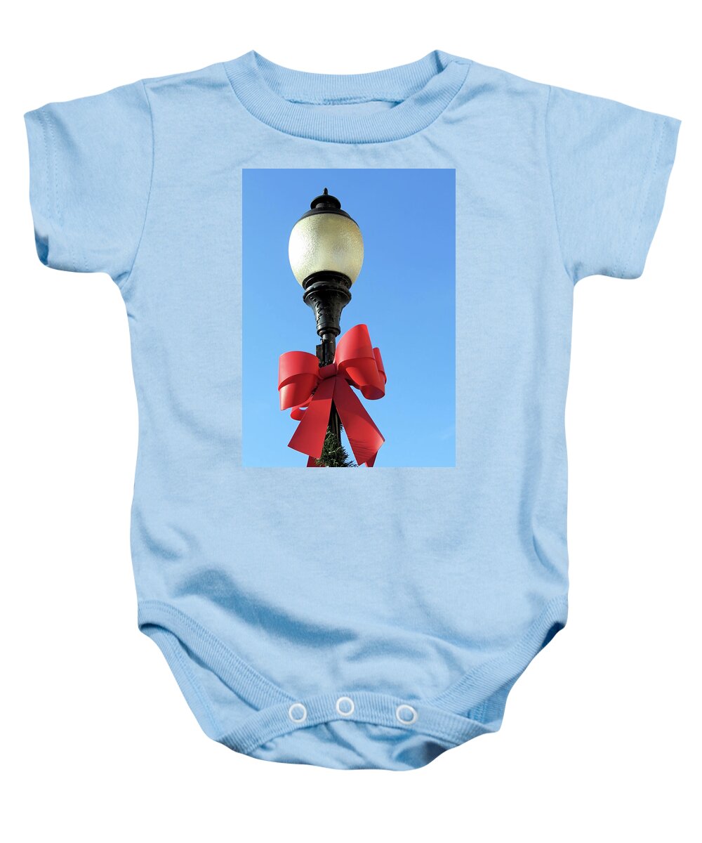 Lamp Post Baby Onesie featuring the photograph Lamp Post with Red Bow by Janice Drew