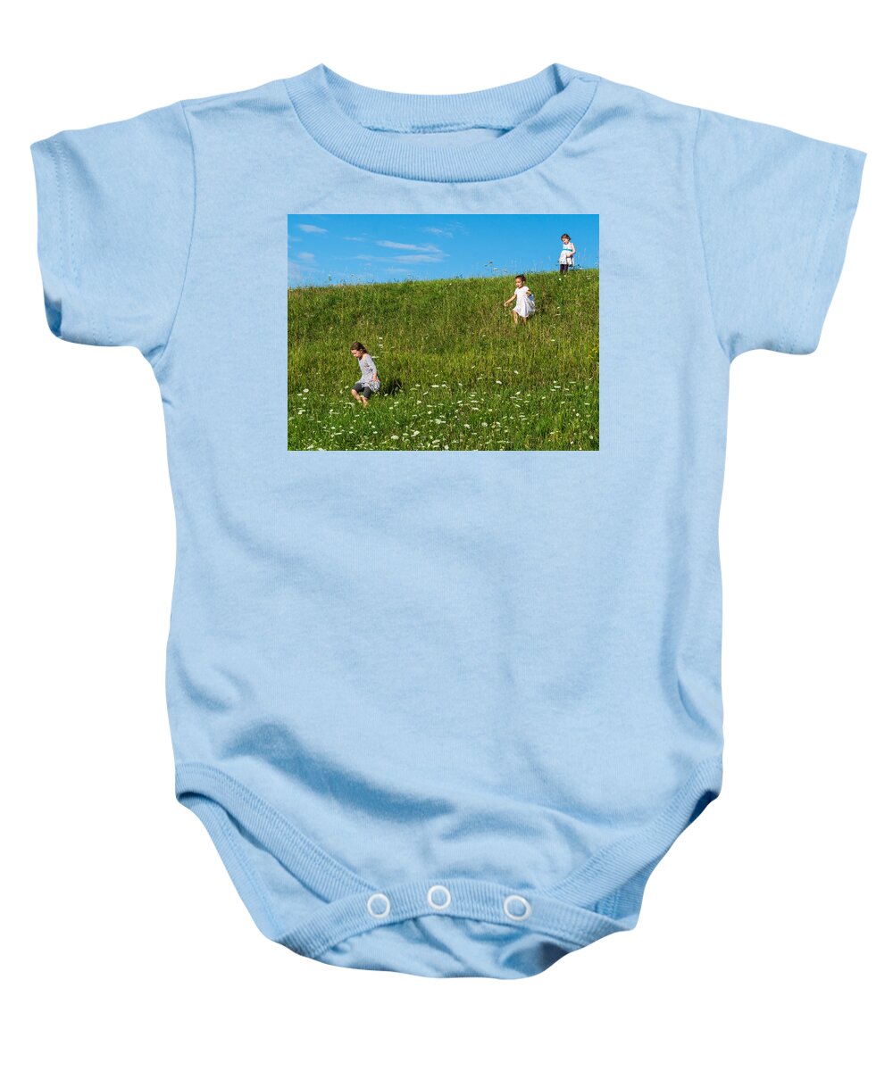 Girls Baby Onesie featuring the photograph Little Girls Running Down Hill by Ann Moore