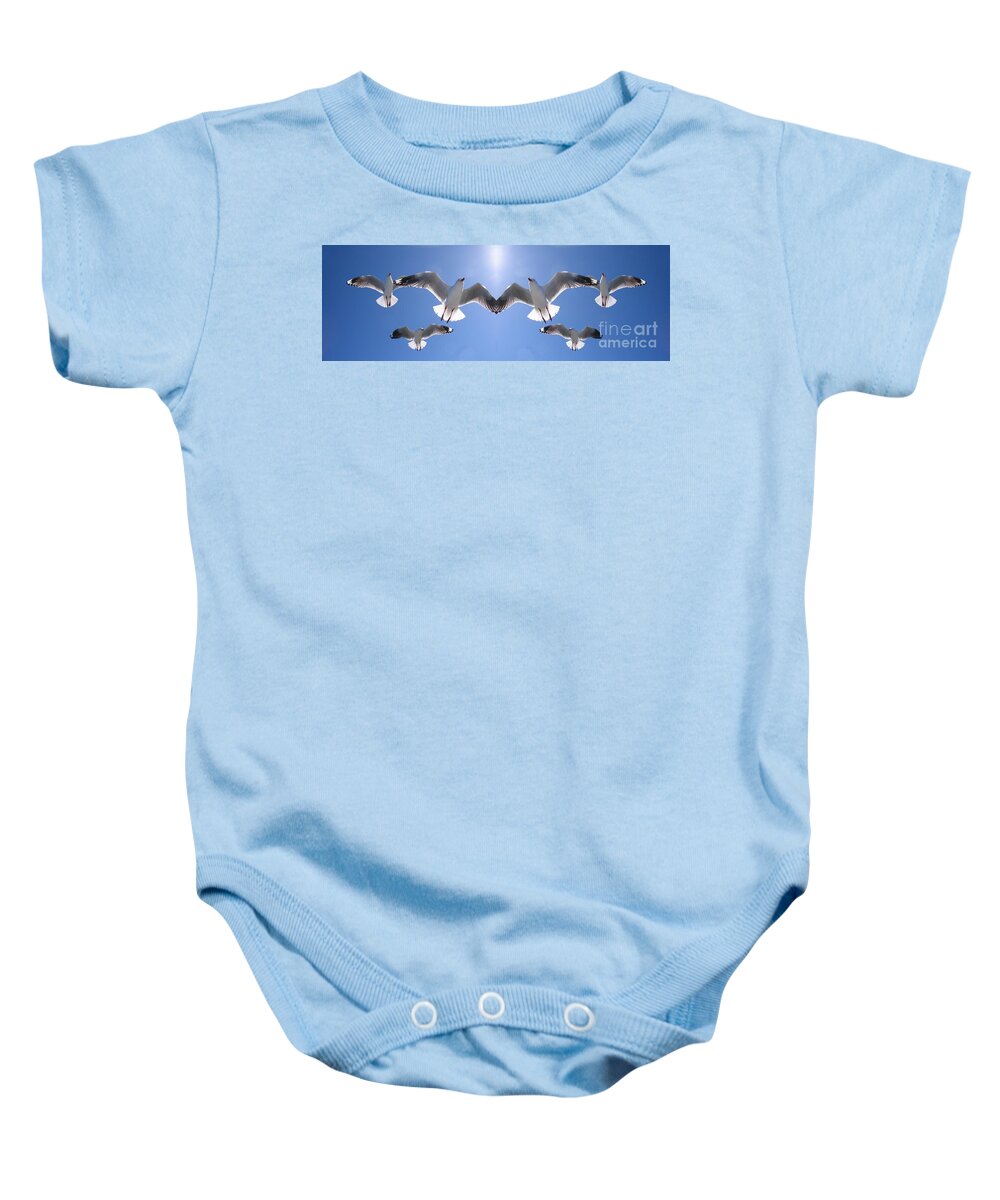 Geoff Childs Baby Onesie featuring the photograph Six Heavenly Backlit Seagulls Flying Overhead in Blue Sky. by Geoff Childs