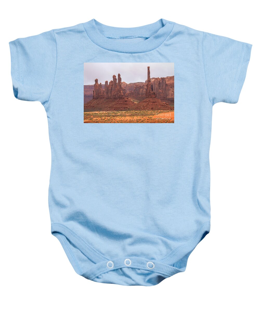 Red Stanchions Baby Onesie featuring the photograph The Stones Cry Out by Jim Garrison