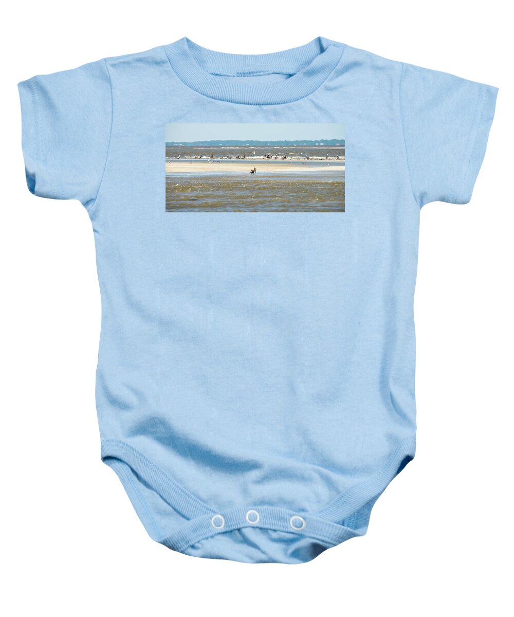 Brown Baby Onesie featuring the photograph Abstract Pelicans In Flight At The Beach Of Atlantic Ocean by Alex Grichenko