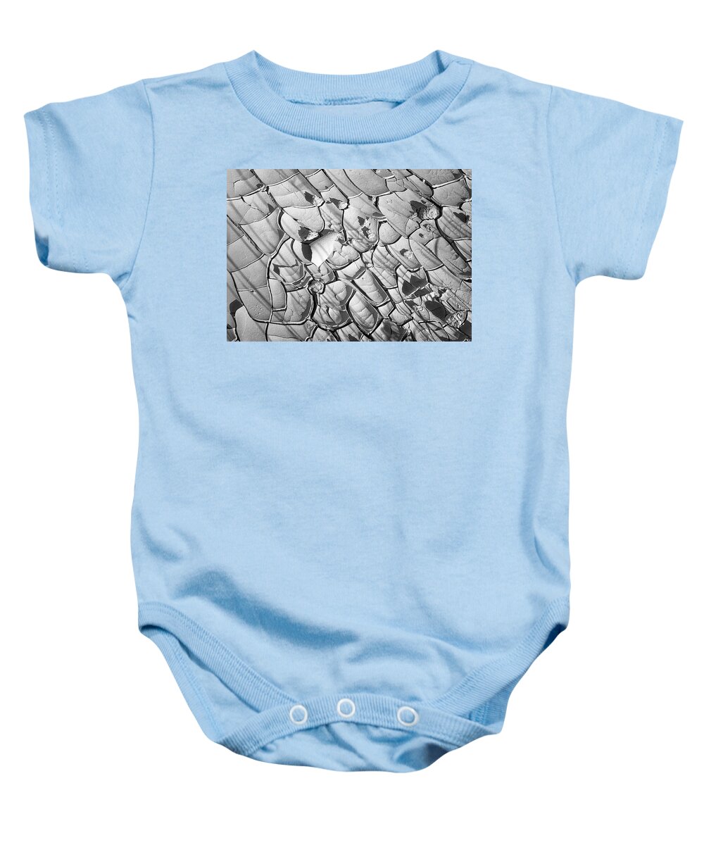 Badlands Baby Onesie featuring the photograph Cracked Earth Abstract by Joan Carroll