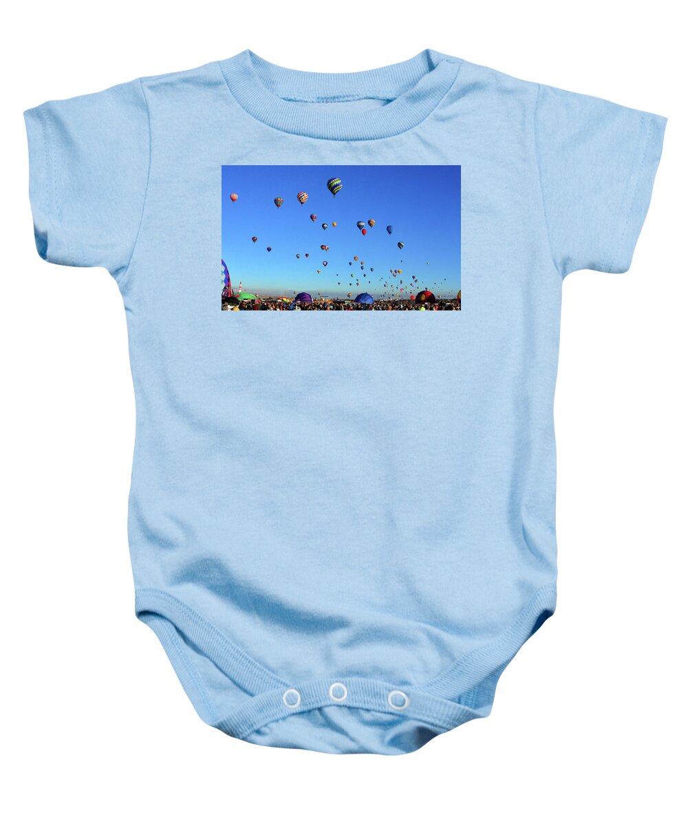 Albuquerque International Balloon Fiesta Baby Onesie featuring the photograph Early morning lift off by David Lee Thompson