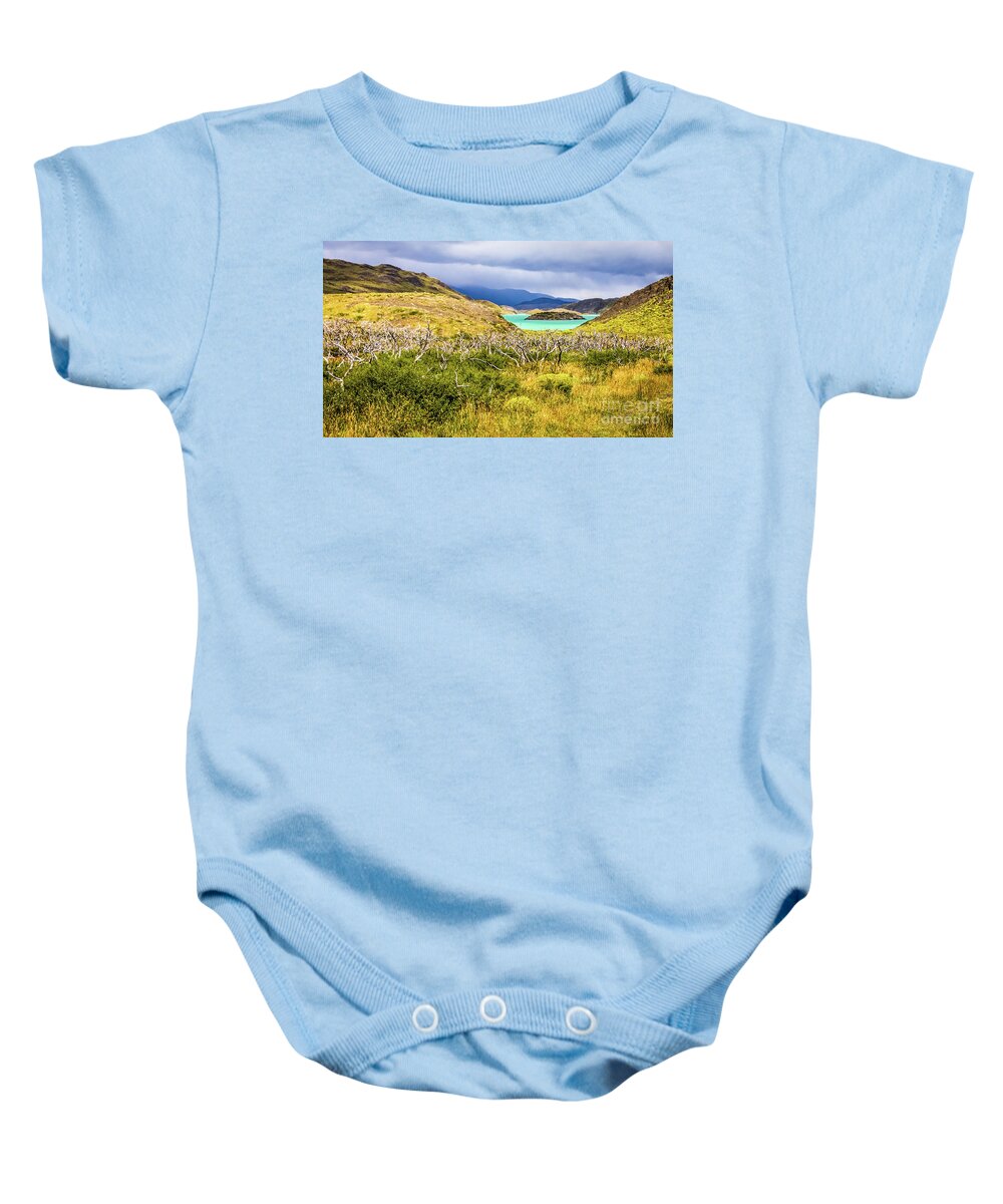 Torres Del Paine Baby Onesie featuring the photograph Blue lagoon in Torres del Paine, Chile by Lyl Dil Creations