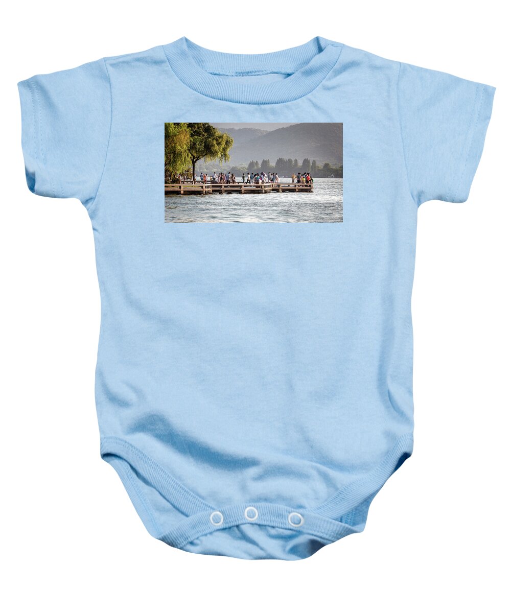 2013 Baby Onesie featuring the photograph People strolling at the edge of the West Lake by Benoit Bruchez
