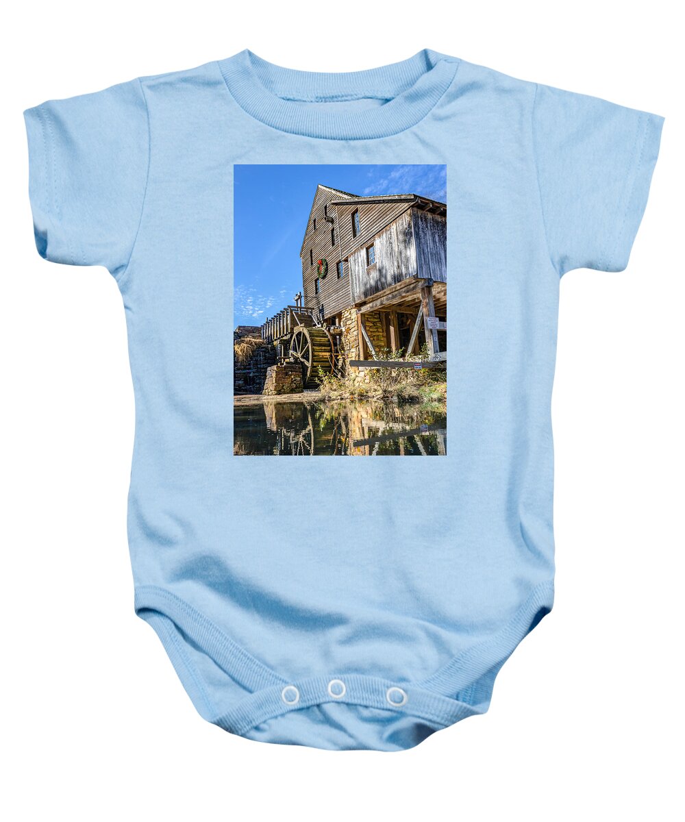 Mill Baby Onesie featuring the photograph Wreath hung on the Mill by Rick Nelson