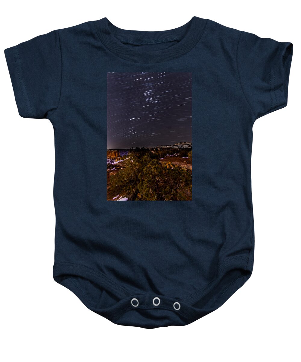 Night Baby Onesie featuring the photograph Monument Trails by Jeff Stoddart