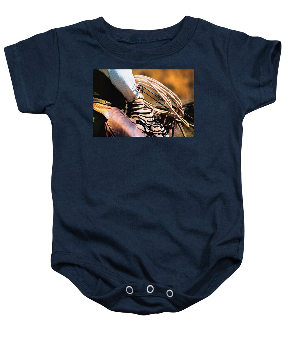 Alone Baby Onesie featuring the photograph Cowboy With Rope by Carson Ganci
