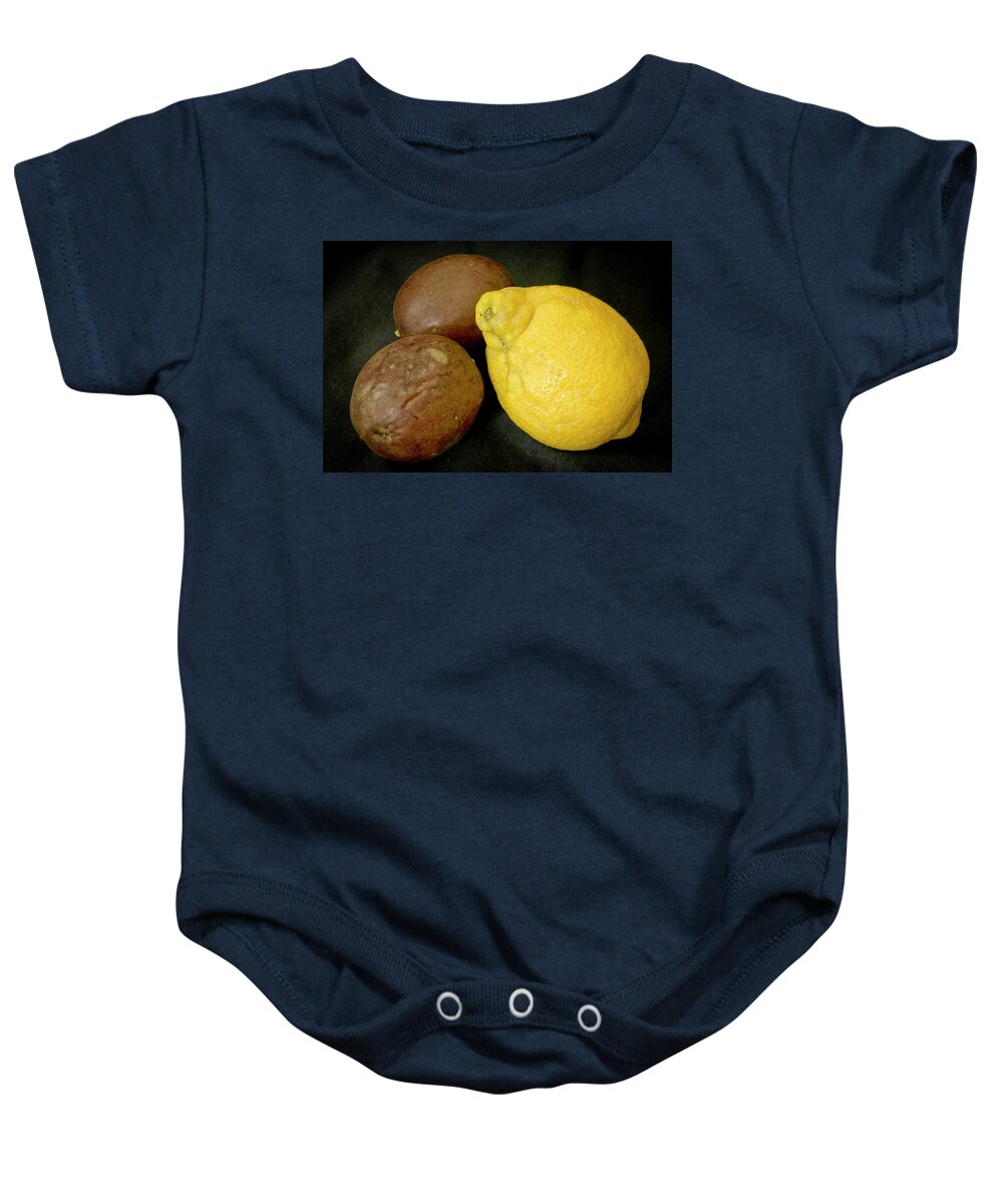 Still Life Baby Onesie featuring the photograph Lemon and a pair of Passion fruit. by Elena Perelman