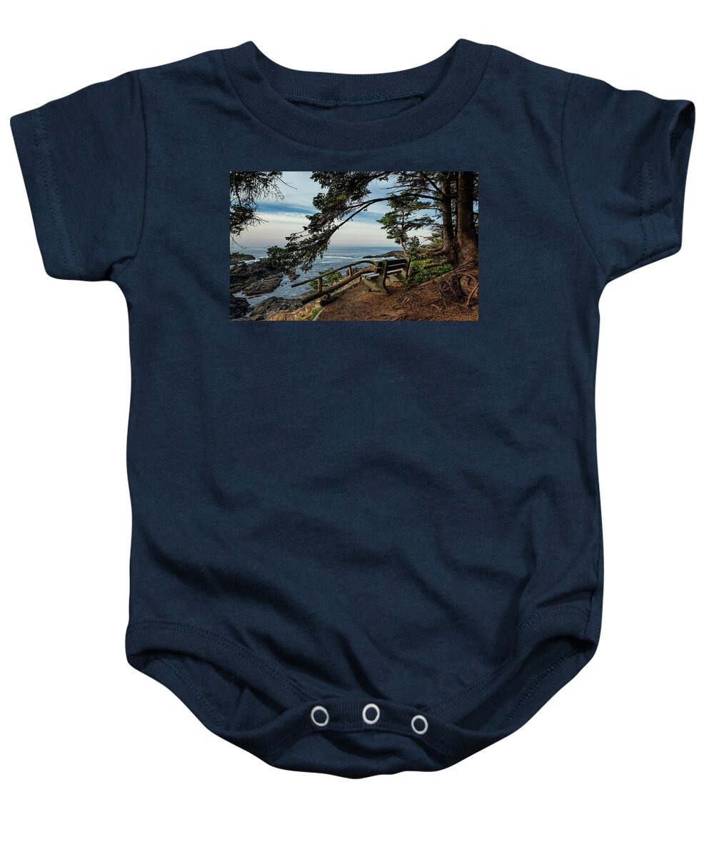 Alex Lyubar Baby Onesie featuring the photograph A bench on the cliff over the seashore by Alex Lyubar
