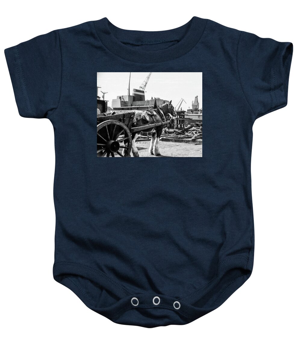 1960s Baby Onesie featuring the photograph A patient horse quietly waits for its load in a Glasgow shipyard by Jeremy Holton