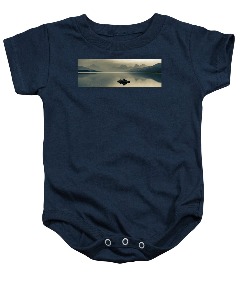 Glacier Park Baby Onesie featuring the photograph Hazy Mountain Landscape Panorama Over Lake McDonald In Sepia by Gregory Ballos