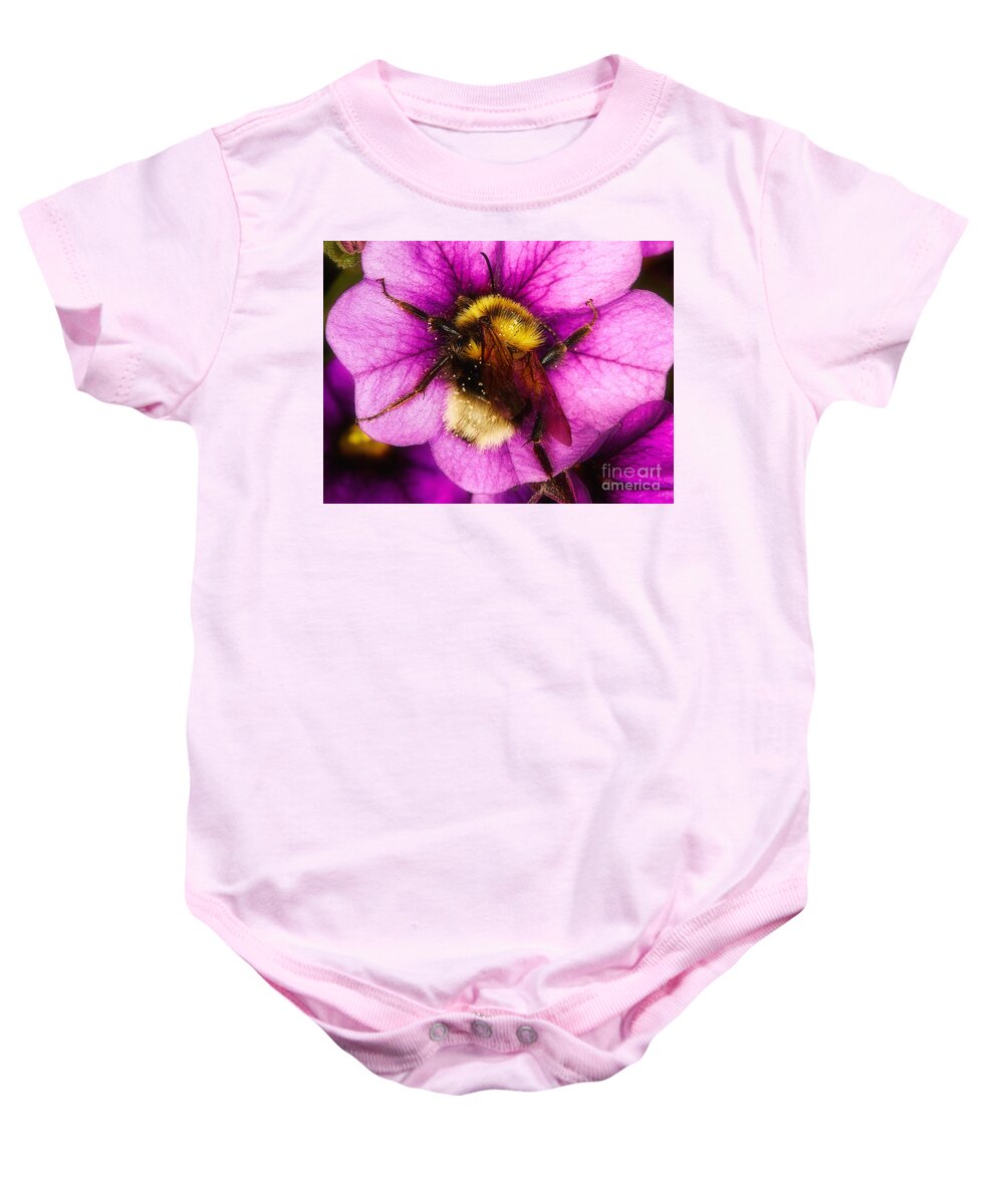 Purple Baby Onesie featuring the photograph Purple petunias with a bumblebee #1 by Nick Biemans