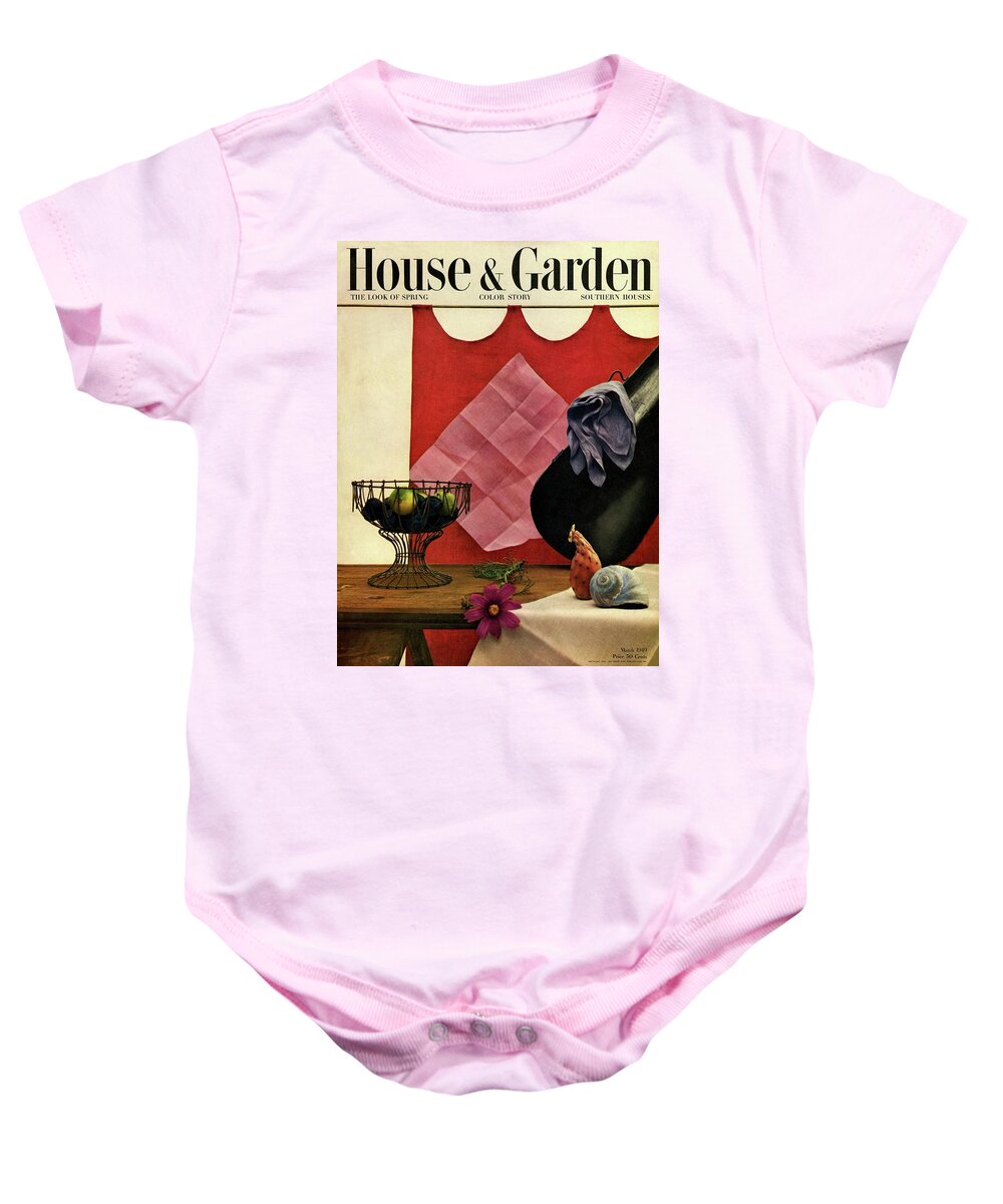 House And Garden Baby Onesie featuring the photograph A Wire Basket On A Wooden Table by John Rawlings