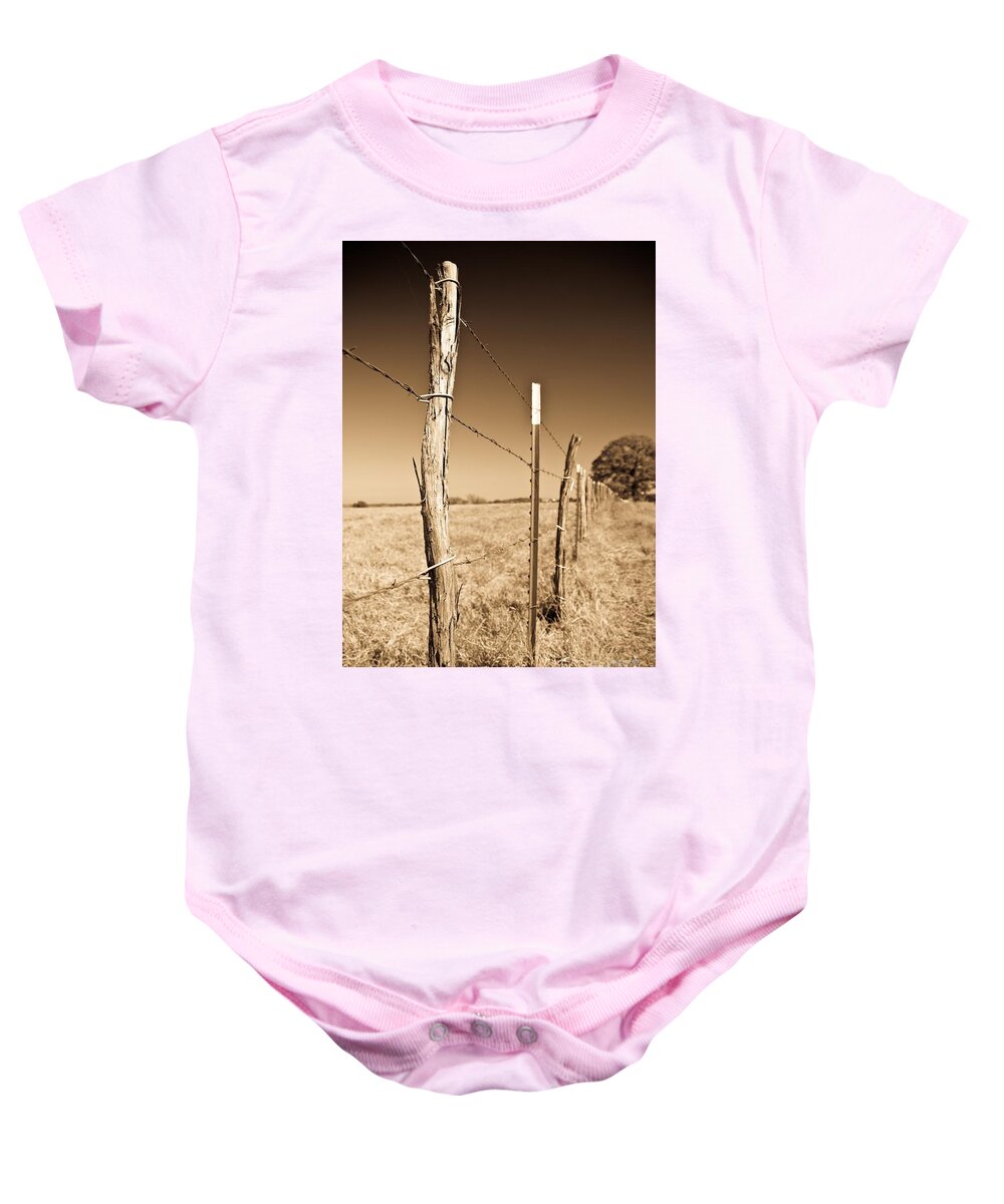 Borders Baby Onesie featuring the photograph Borders by Charles Dobbs