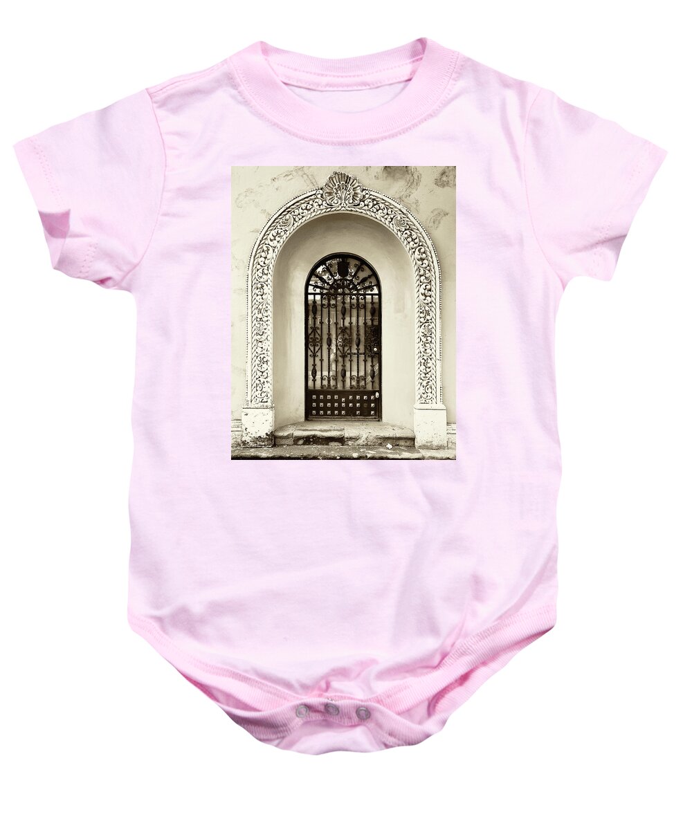 Architecture Baby Onesie featuring the photograph Door with decorated arch by Roberto Pagani