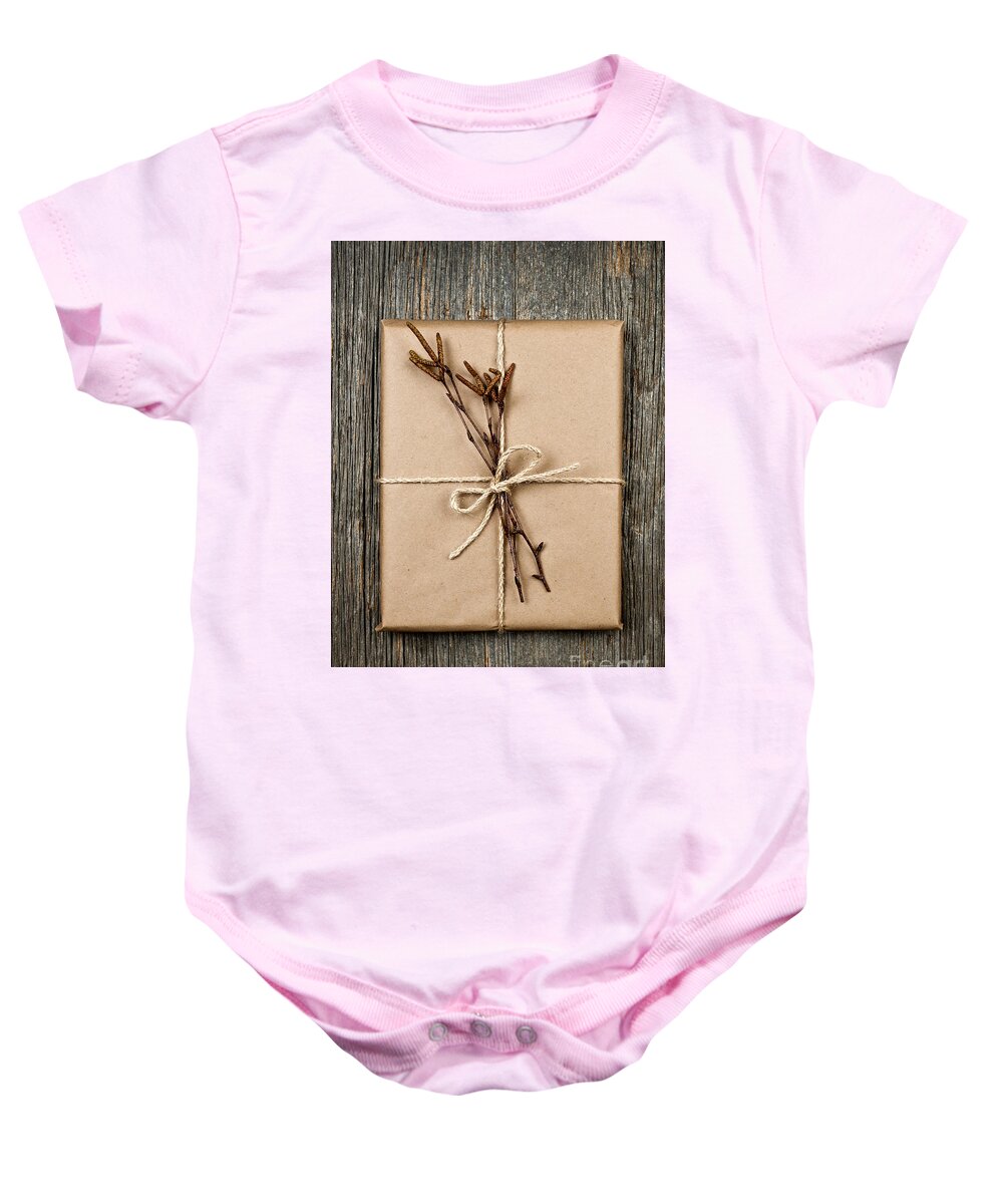 Package Baby Onesie featuring the photograph Plain gift with natural decorations by Elena Elisseeva
