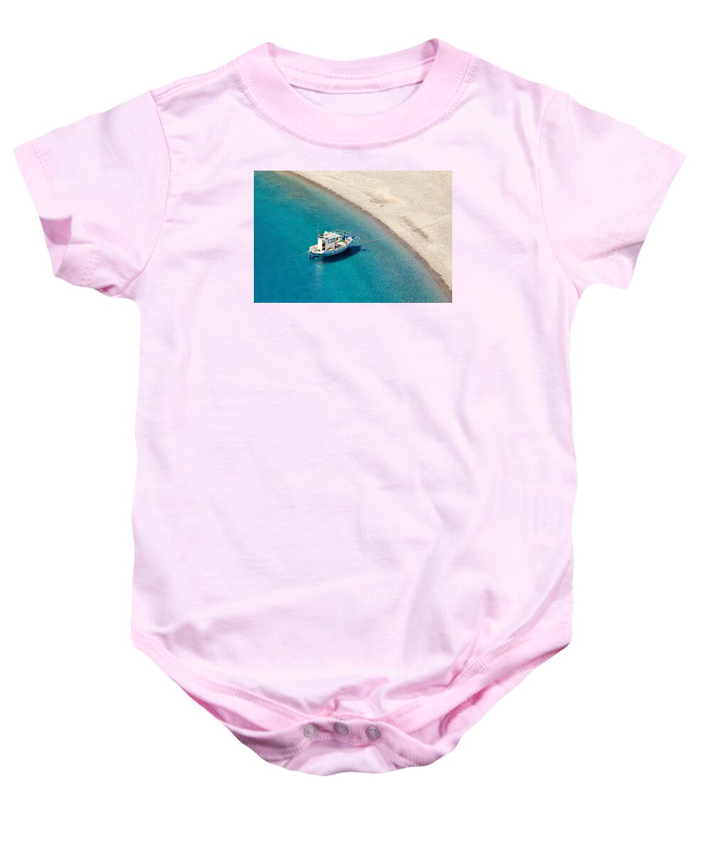 Agios Baby Onesie featuring the photograph A fishing boat in Agios Minas beach of Karpathos - Greece by Constantinos Iliopoulos