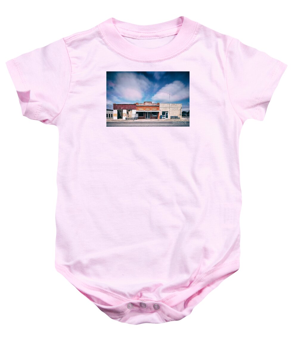 Joseph Baby Onesie featuring the photograph Abbott A Quitter Never Wins And A Winner Never Quits - Willie Nelson's Birthplace Texas by Silvio Ligutti