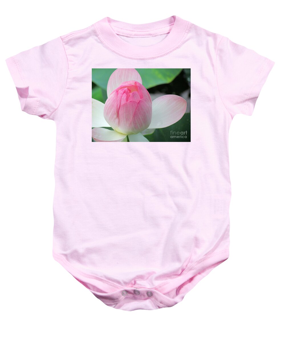 Flower Baby Onesie featuring the photograph Lotus Petals Gently Unfurl by Lori Lafargue