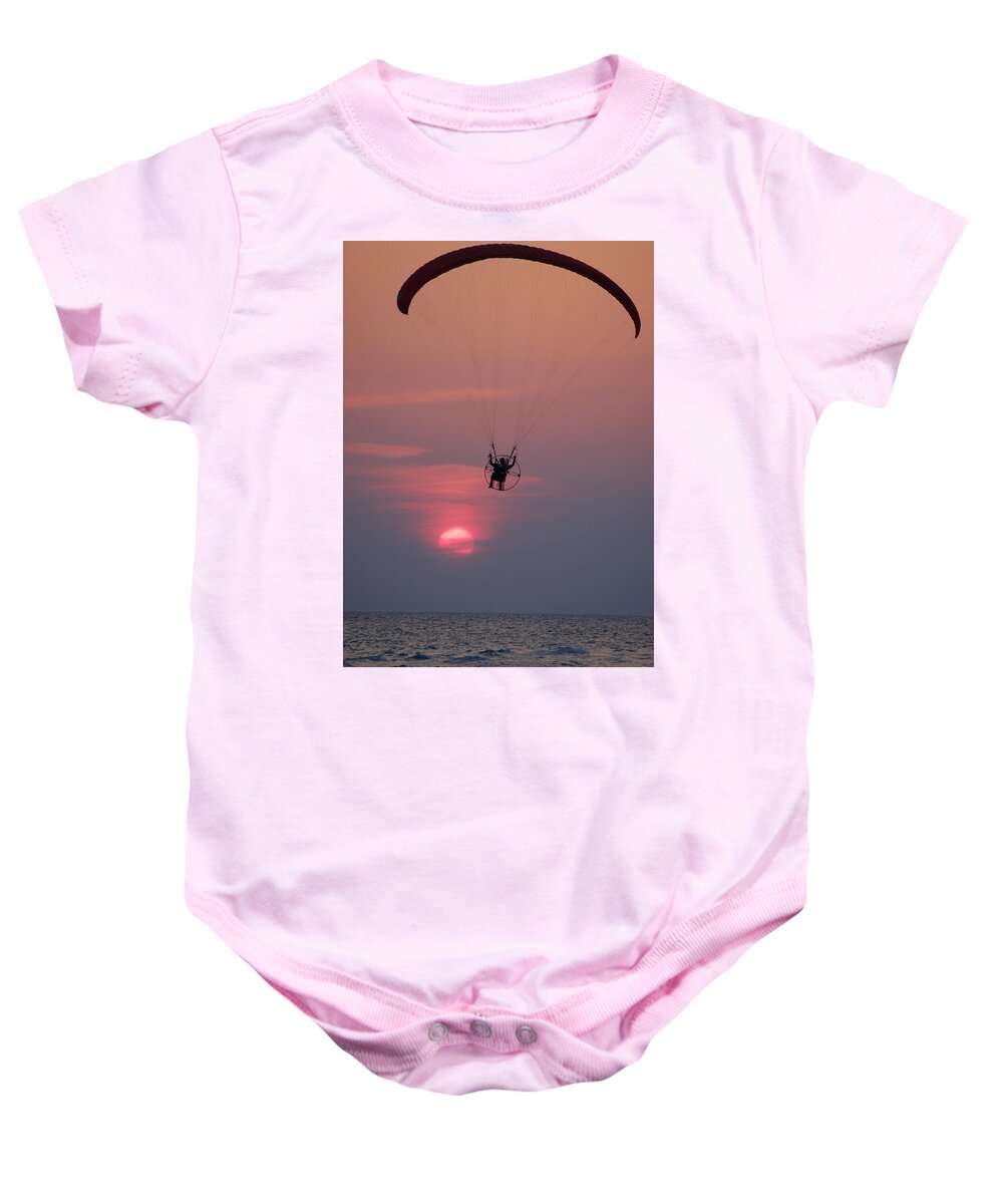 Glider Baby Onesie featuring the photograph Glider over the ocean at sunset by Dennis Schmidt