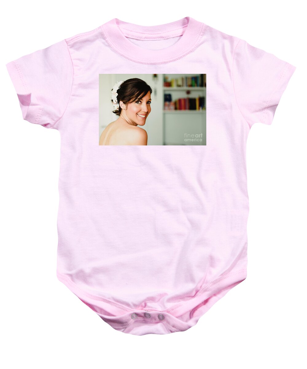 Adult Baby Onesie featuring the photograph Young woman from behind smiling by Joaquin Corbalan