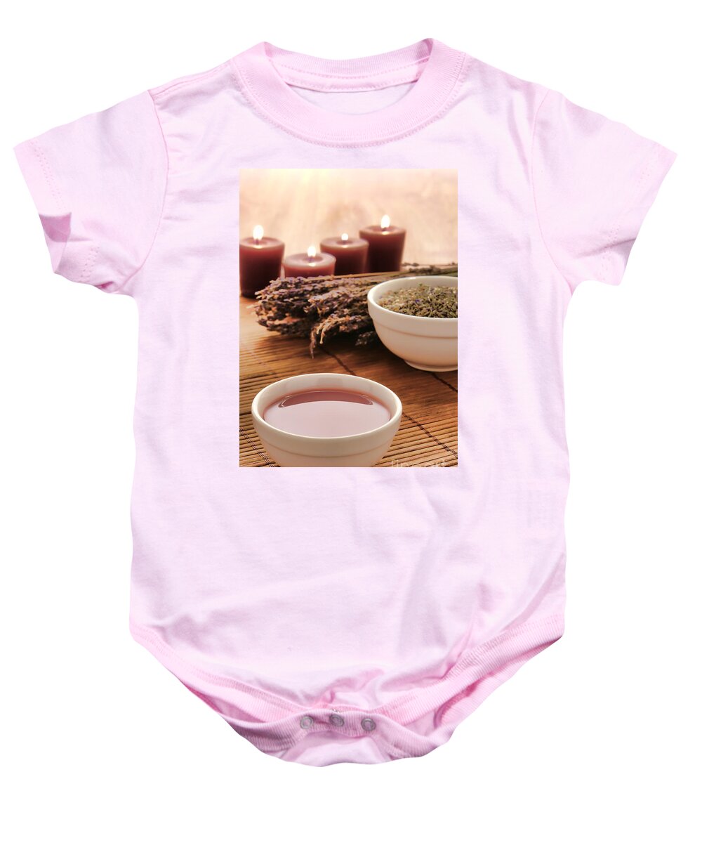 Bowl Baby Onesie featuring the photograph Hot Massage Oil in a Bowl with Lavender in spa by Olivier Le Queinec