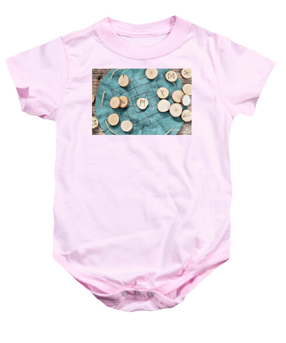 Runes Baby Onesie featuring the photograph Handmade runes for fortunetelling by Anastasy Yarmolovich