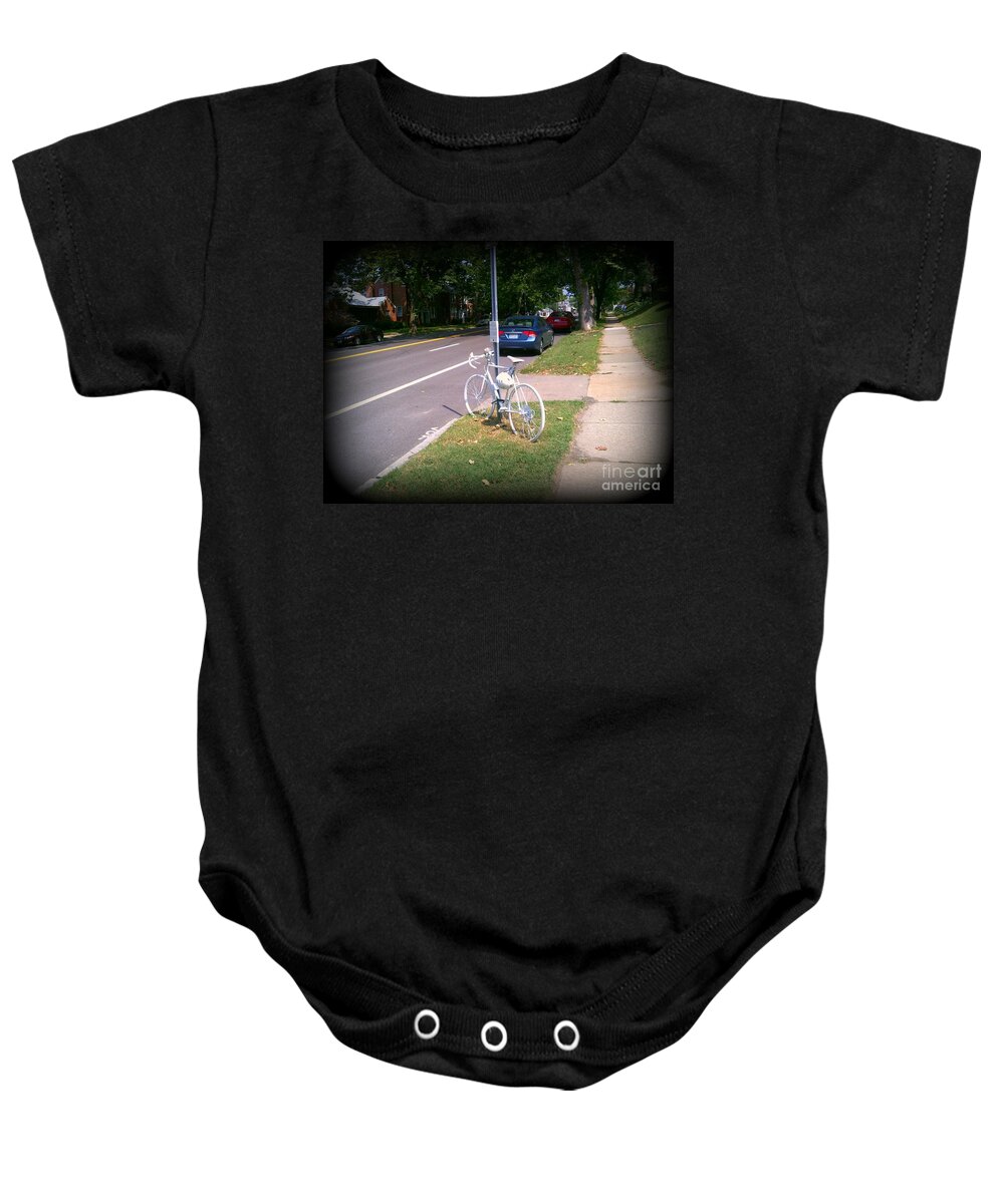  Baby Onesie featuring the photograph A Fallen Cyclist by Kelly Awad