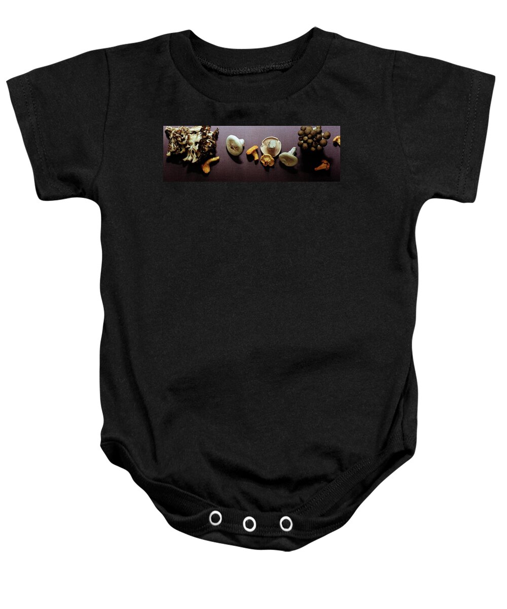 Vegetables Baby Onesie featuring the photograph An Assortment Of Mushrooms by Romulo Yanes