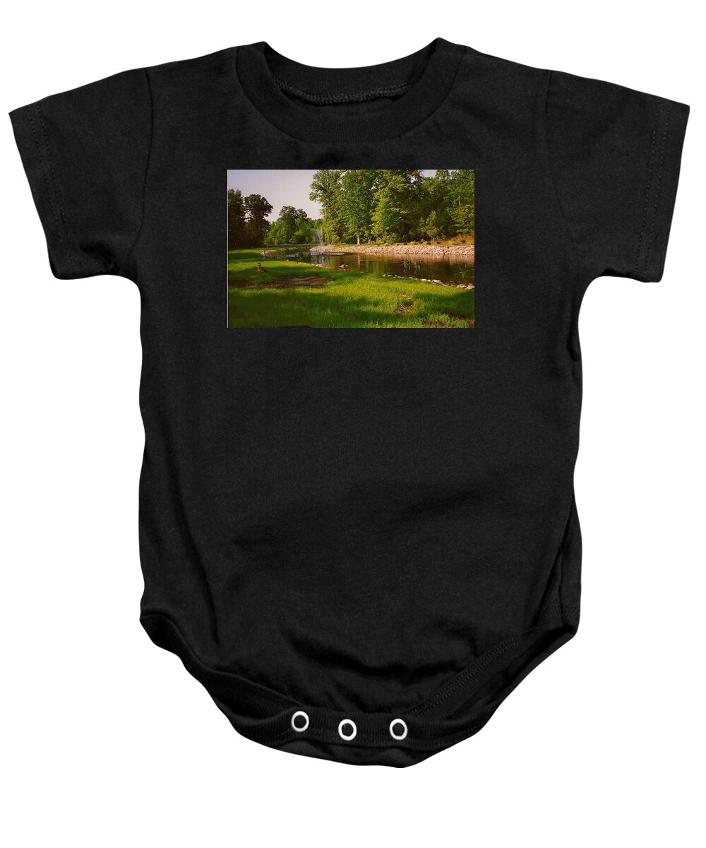Ducks Baby Onesie featuring the photograph Duck Pond With Water Fountain by Chris W Photography AKA Christian Wilson
