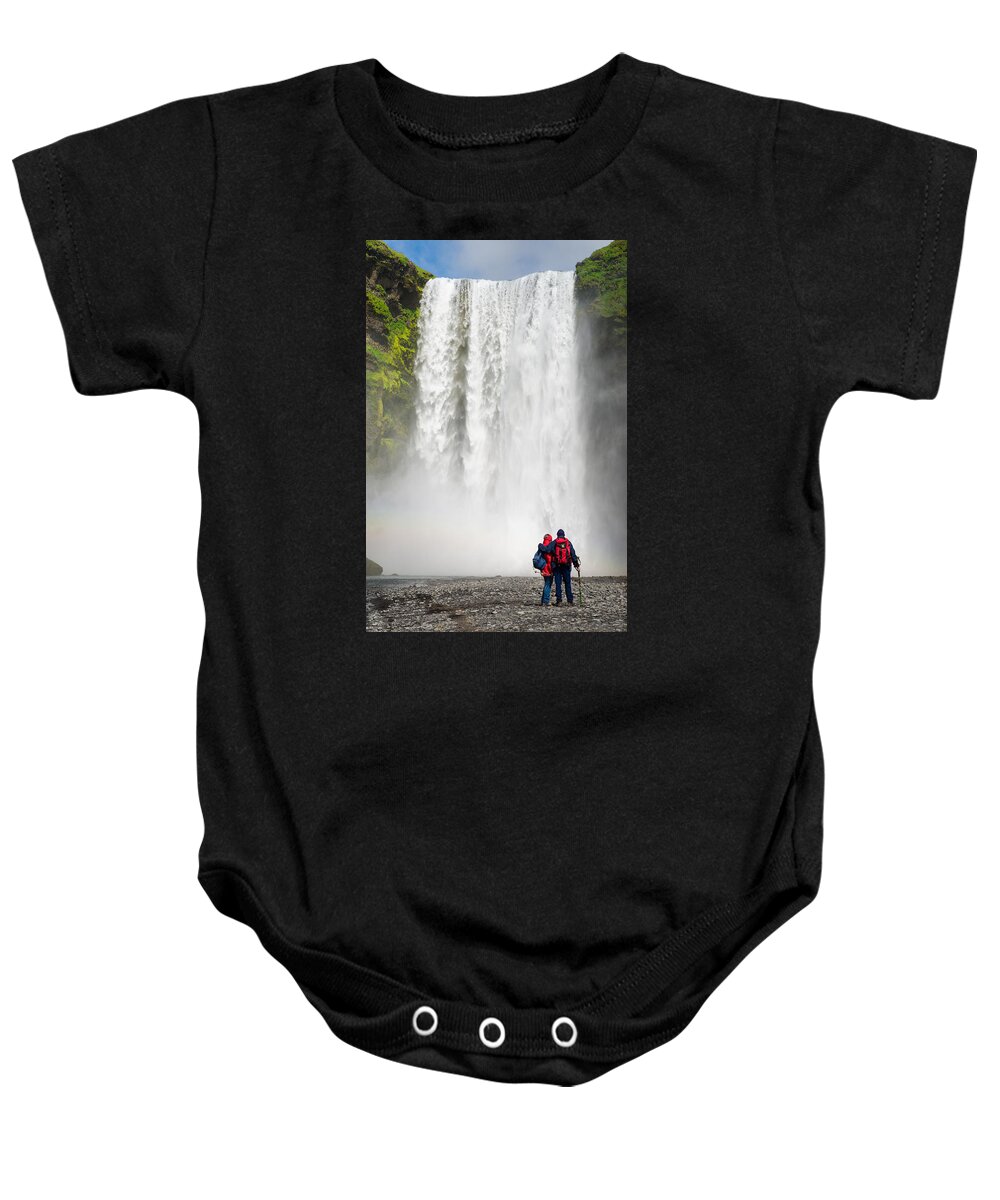 Iceland Baby Onesie featuring the photograph Enjoying Skogafoss waterfall in Iceland by Matthias Hauser