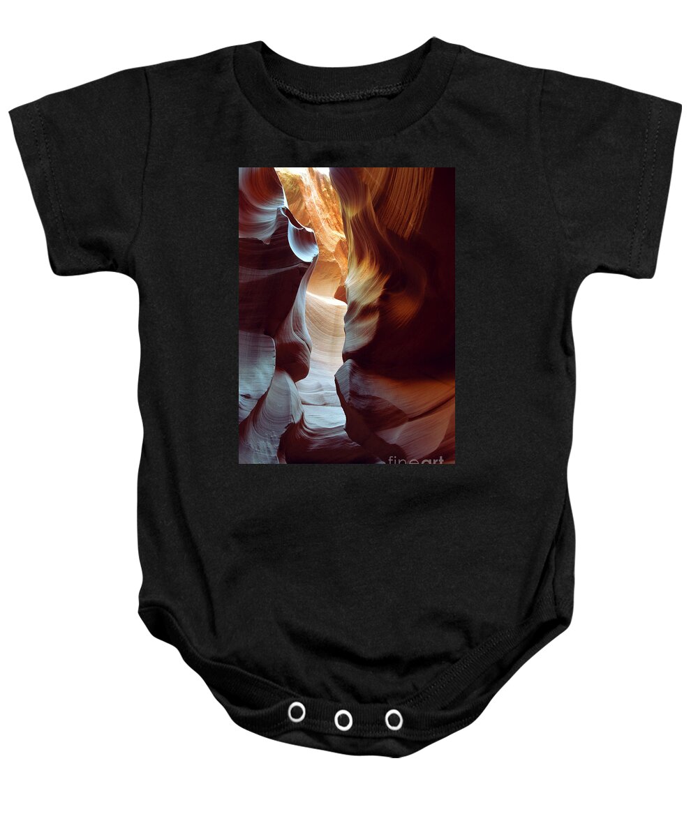 Slot Canyon Baby Onesie featuring the photograph Follow the Light II by Kathy McClure