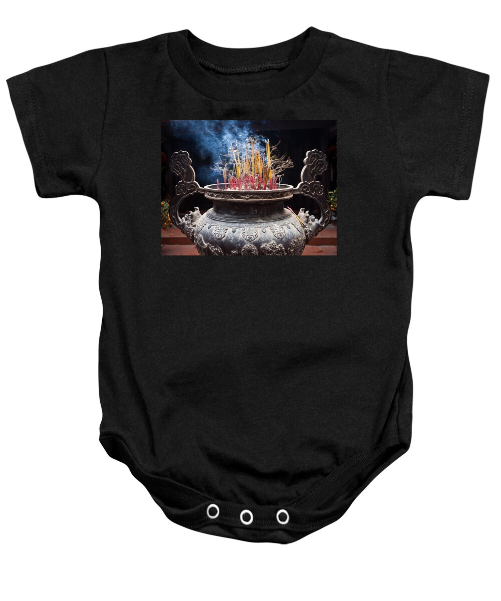 Aroma Baby Onesie featuring the photograph Incense Sticks Burn In Large Ceremonial Temple Urn by Jo Ann Tomaselli