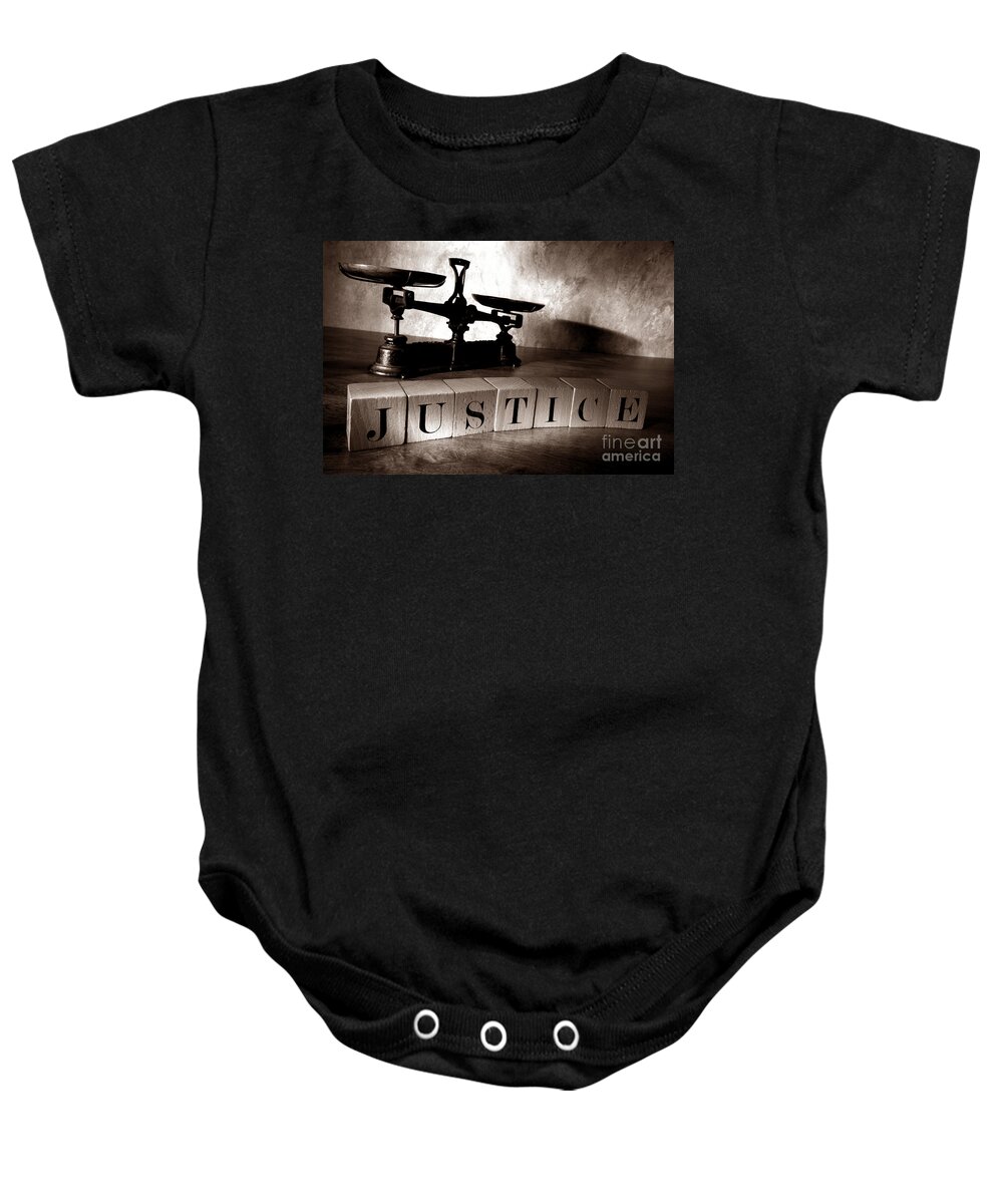 Justice Baby Onesie featuring the photograph Justice by Olivier Le Queinec