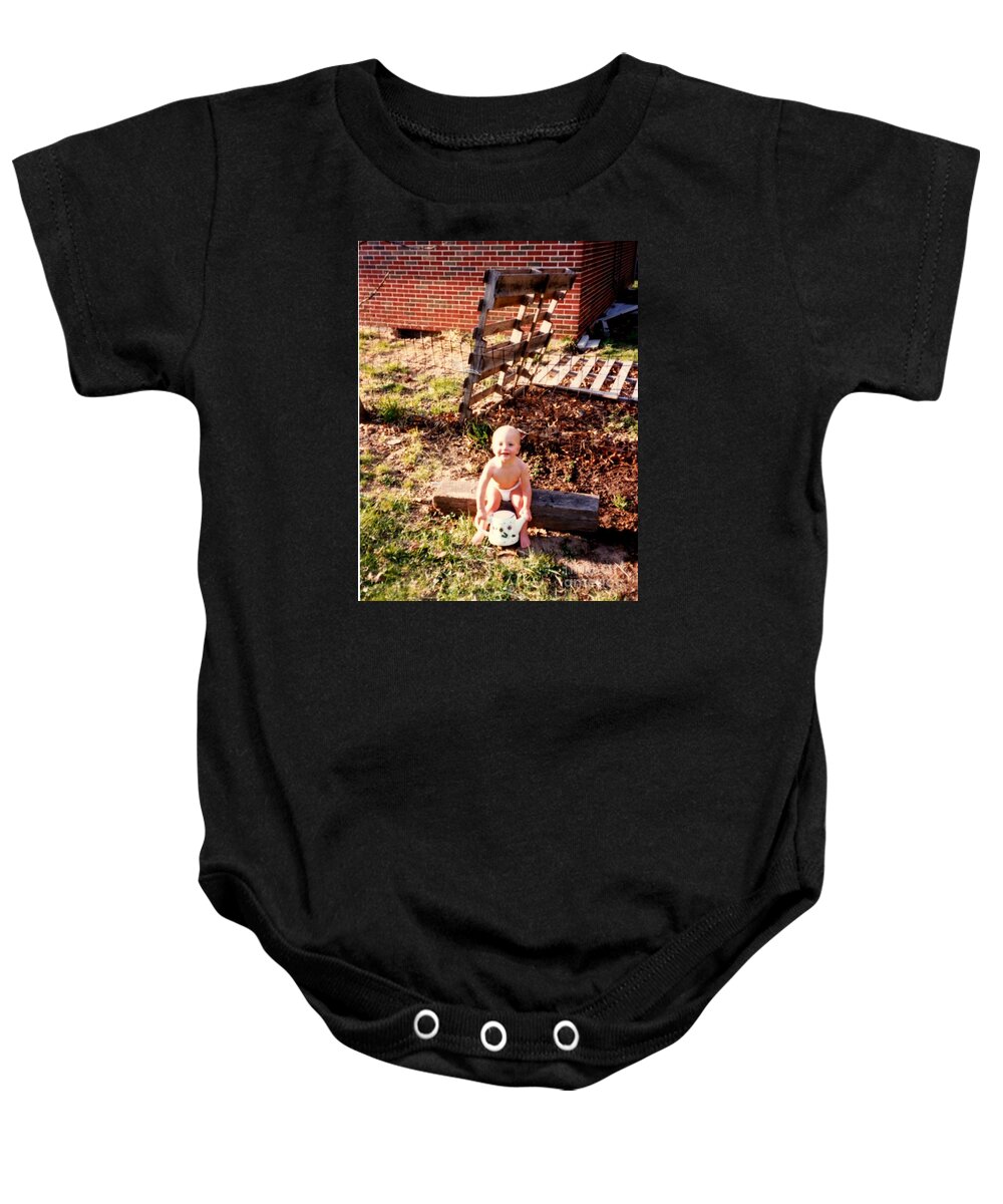  Baby Onesie featuring the photograph My Lil Gardener by Kelly Awad