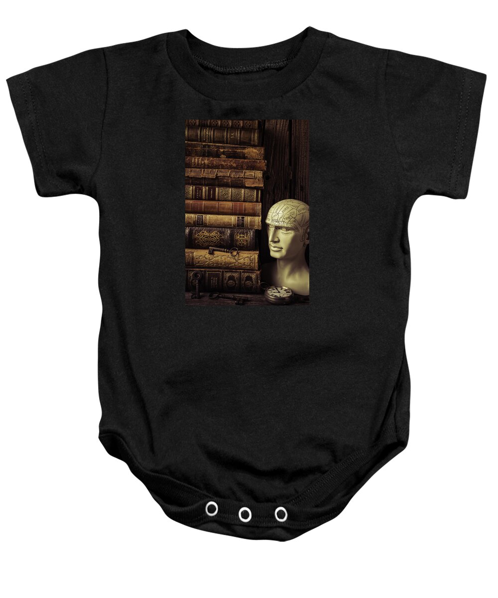 Phrenology Baby Onesie featuring the photograph Phrenology Head And Old Books by Garry Gay