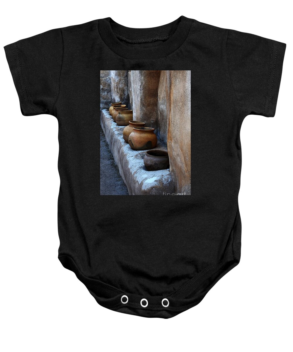 Tumacacori Baby Onesie featuring the photograph Pottery At Mission San Jose De Tumacacori by Bob Christopher