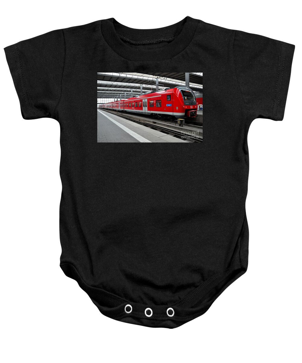 Train Baby Onesie featuring the photograph Red commuter train parked at Munich station Germany by Imran Ahmed