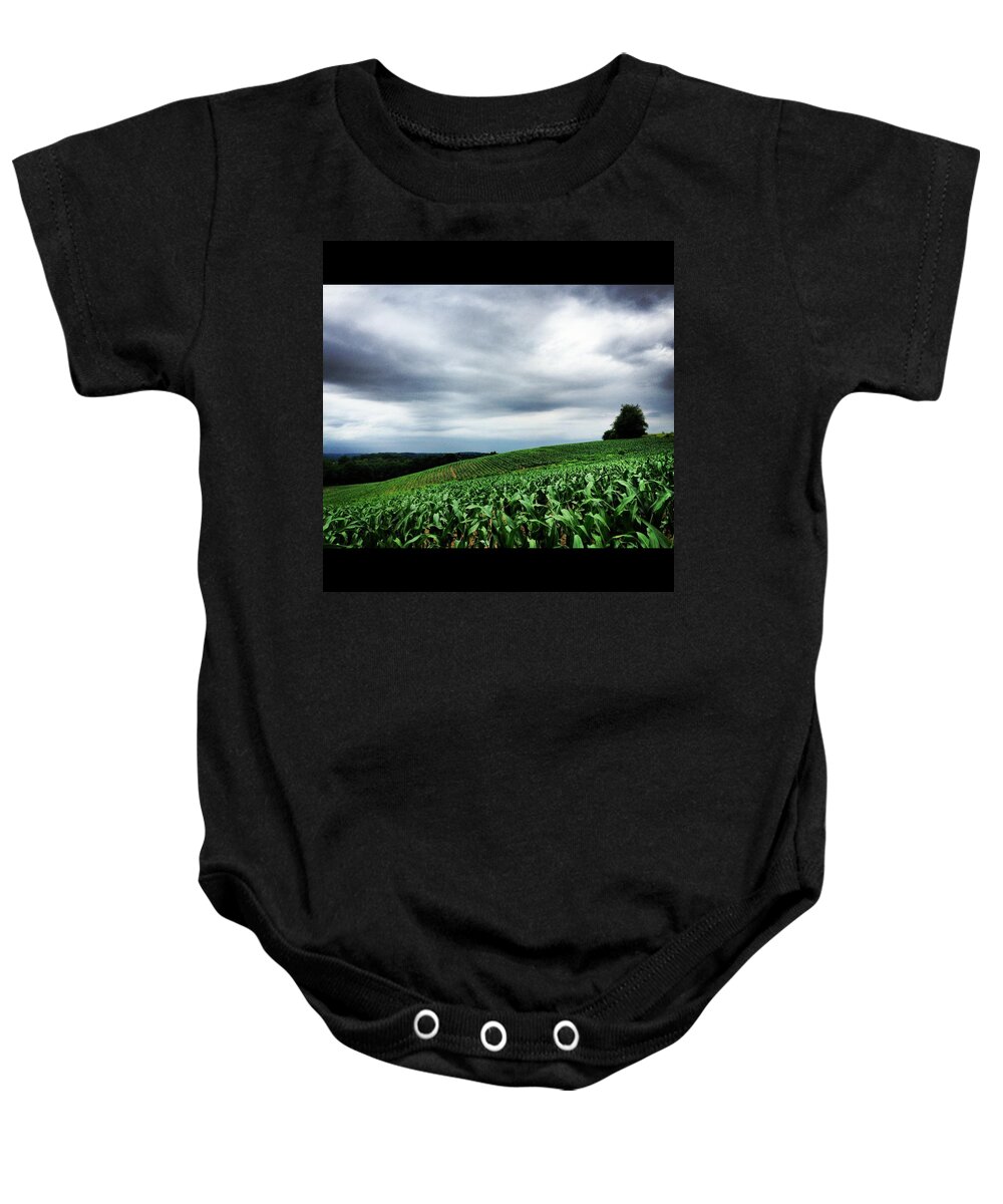 Green Baby Onesie featuring the photograph Rolling Corn Field After Storm by Angela Rath