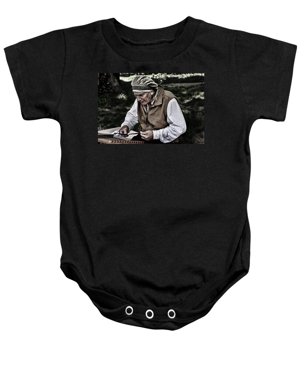 Evie Baby Onesie featuring the photograph The Dulcimer Man by Evie Carrier
