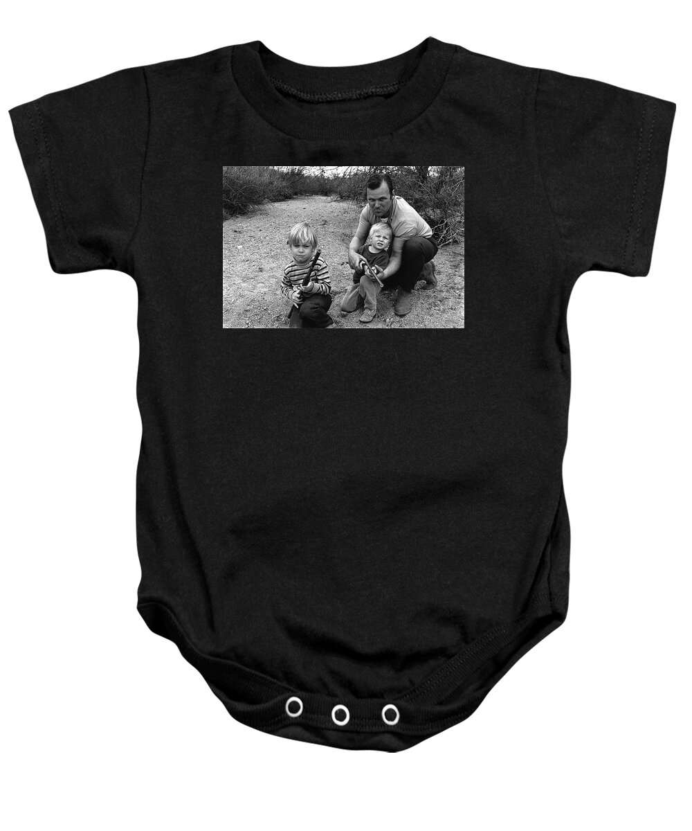 The Green Berets Homage 1968 Barry Sadler And Sons Tucson Arizona John Wayne Toy Guns Black And White Dry River Bed Baby Onesie featuring the photograph The Green Berets homage 1968 Barry Sadler and sons Tucson Arizona by David Lee Guss
