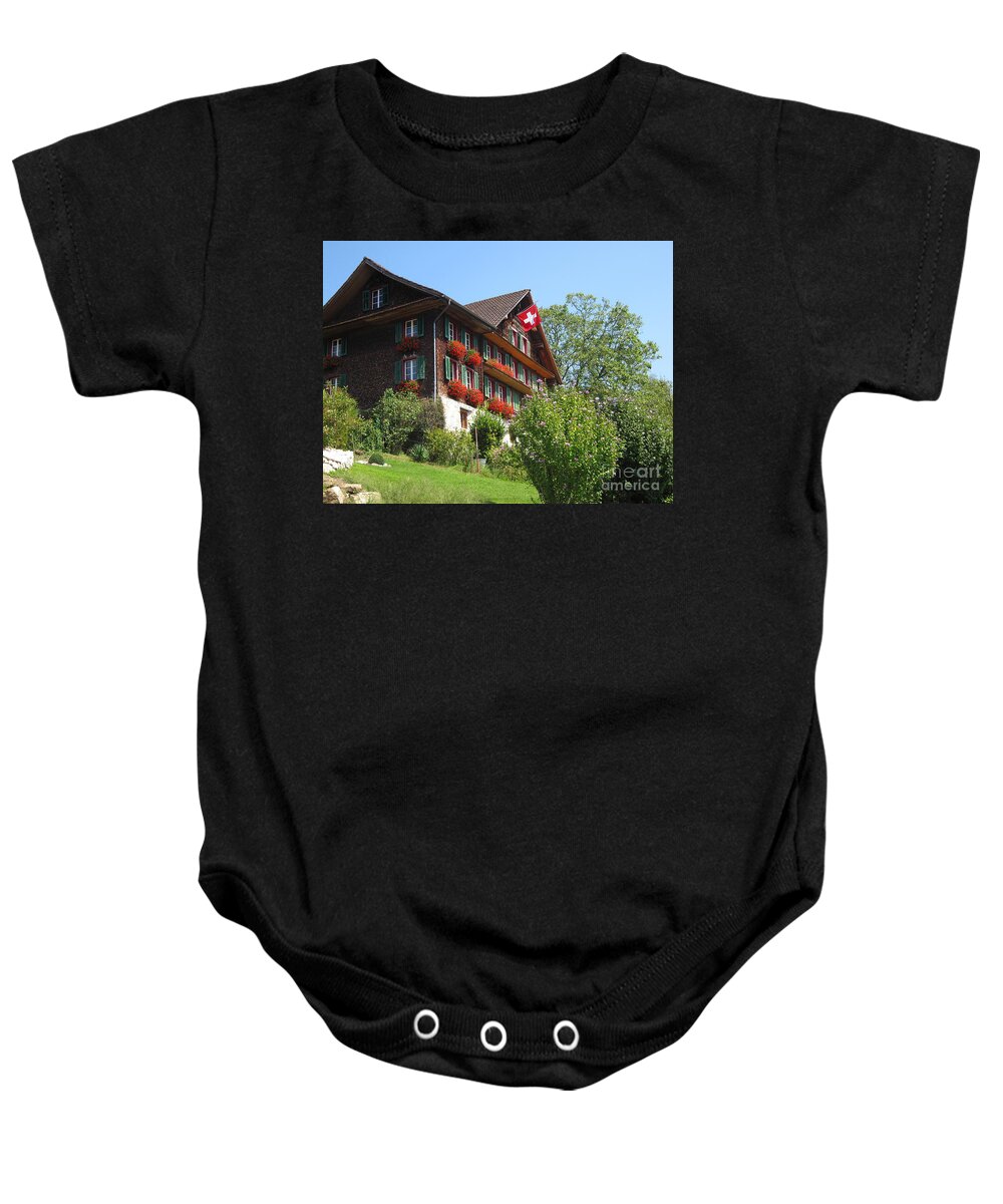 Architecture Baby Onesie featuring the photograph Traditional wooden Swiss House by Amanda Mohler