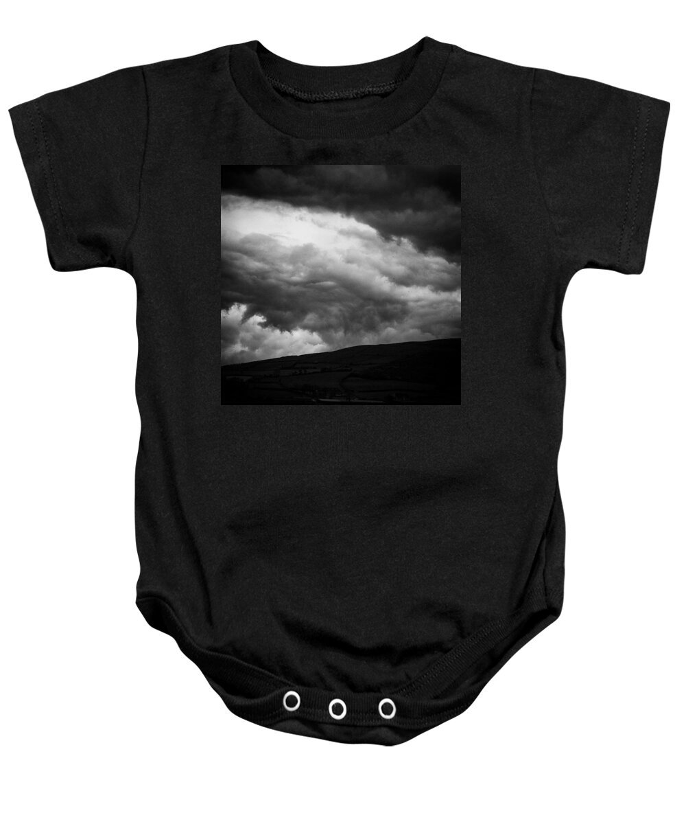 Beautiful Baby Onesie featuring the photograph When The Clouds Come Rolling In by Aleck Cartwright