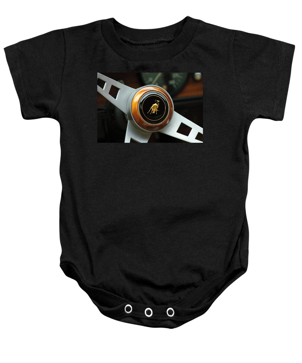 Lamborghini Baby Onesie featuring the photograph Lamborghini Steering Wheel Emblem by Jill Reger