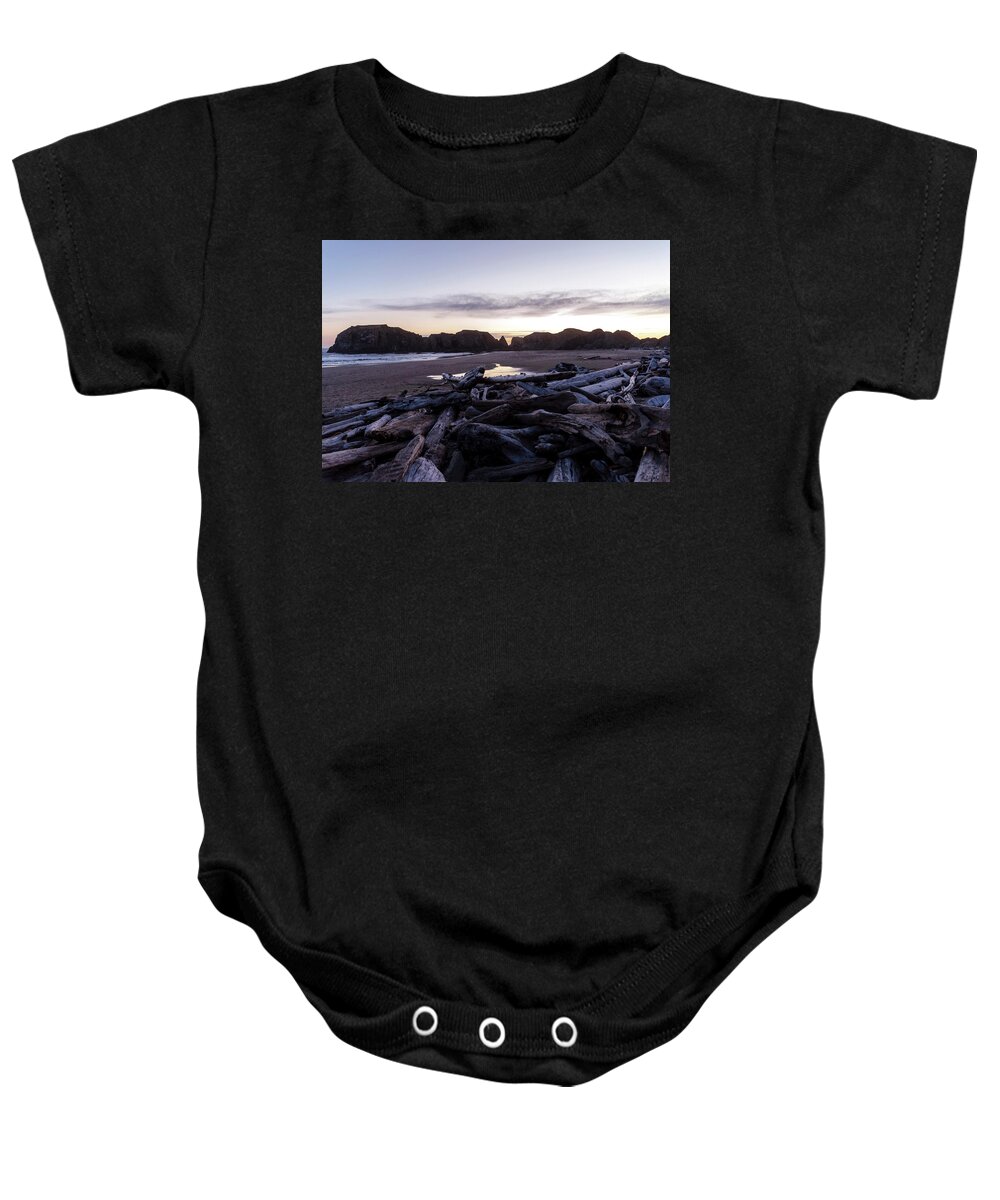 Beaches Baby Onesie featuring the photograph Among The Driftwood by Steven Clark
