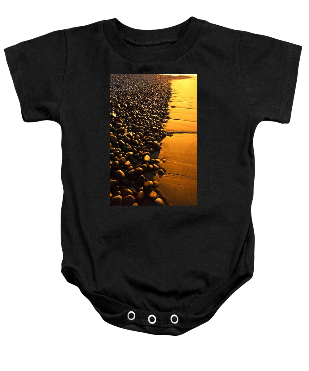 Sunrise Baby Onesie featuring the photograph Beach Stones At Sunrise by Irwin Barrett