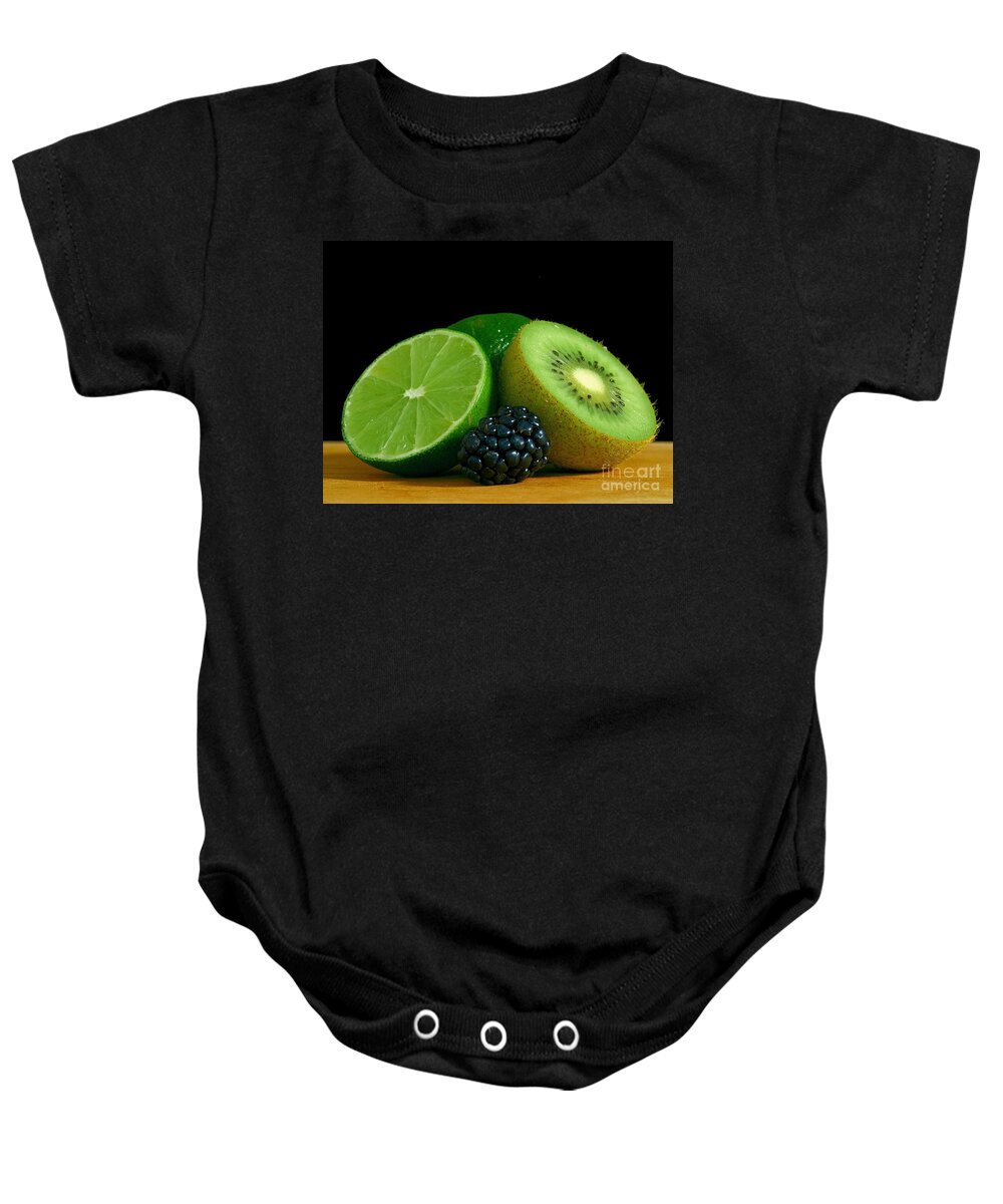 Chopped Limes Kiwi Berry On Table Baby Onesie featuring the photograph Chopped Limes Kiwi Berry On Table by Vintage Collectables